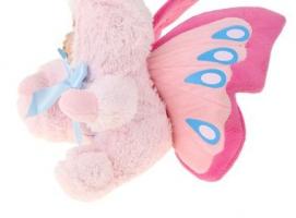 Кукла коллекционная Малыш в костюме бабочки сидит