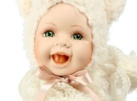 Кукла коллекционная Малыш в костюме лохматого медвежонка